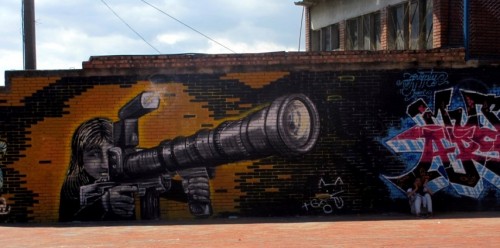 camera gun graffiti